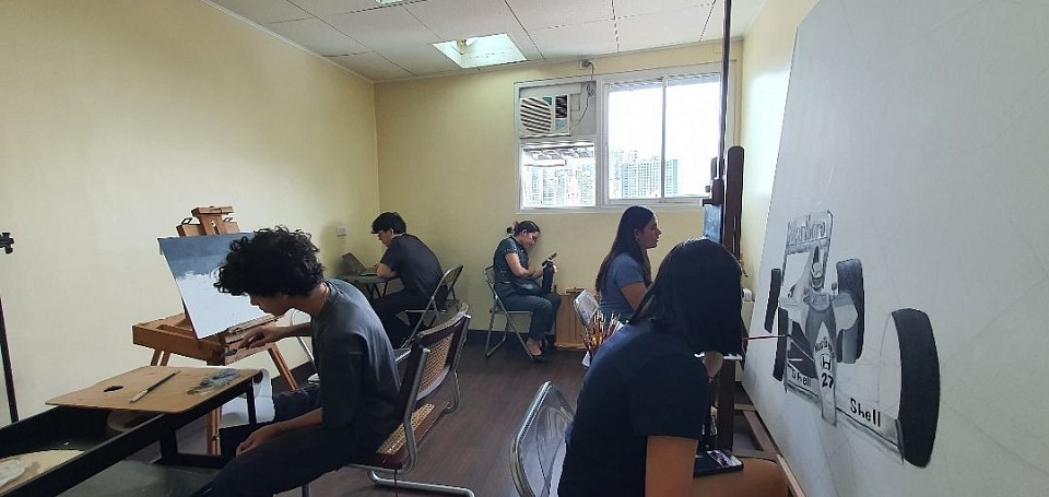 A quiet working studio where students develop their artistic practice through patience, observation, and steady mentorship.